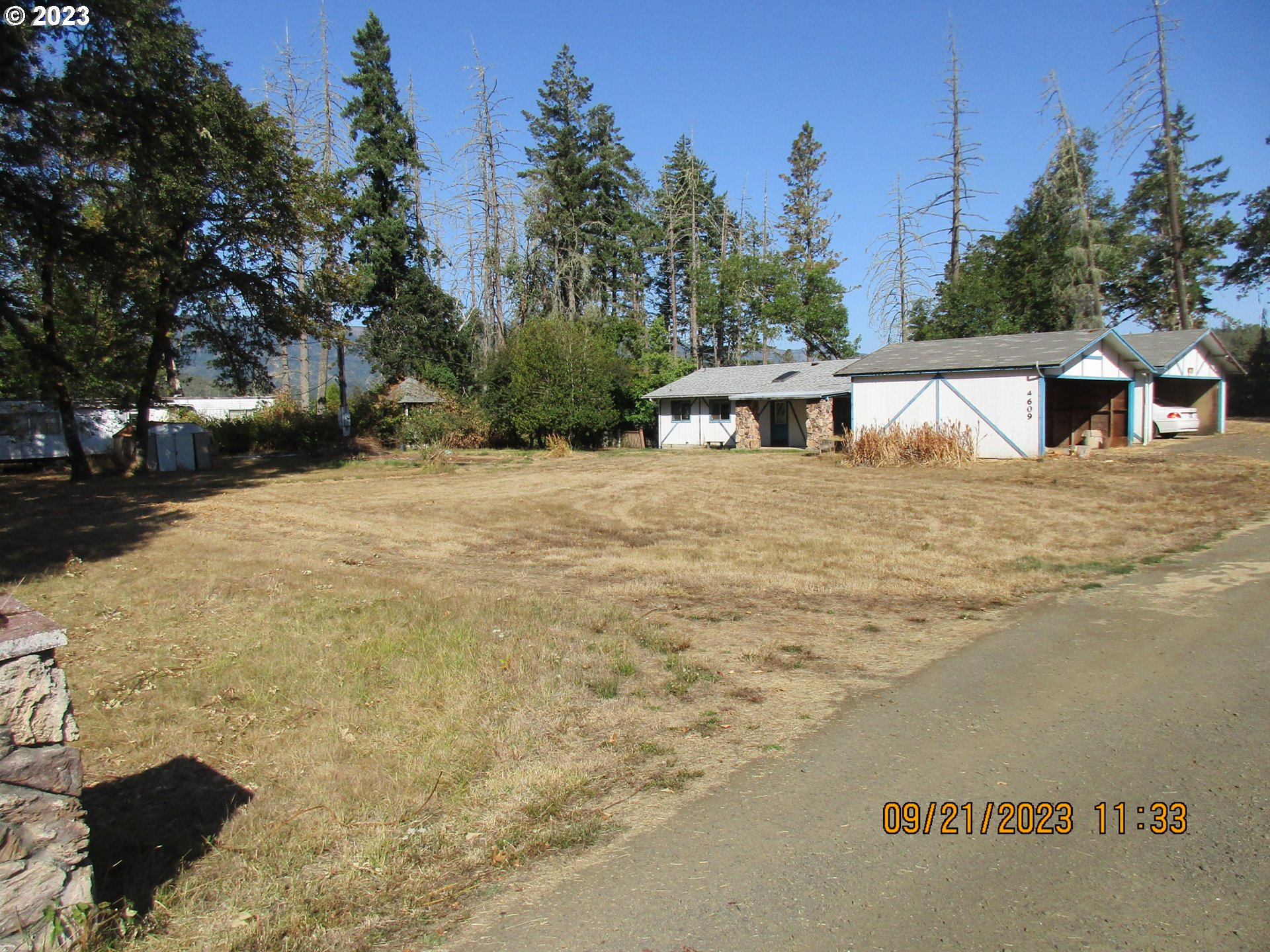 4609 Melrose Road Roseburg, OR 97471 - Photo 12 of 17 a view of a house with a yard