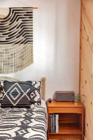 a bedroom with a bed and a window