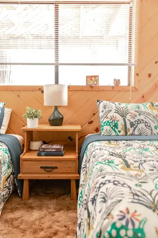 a bedroom with a bed and window