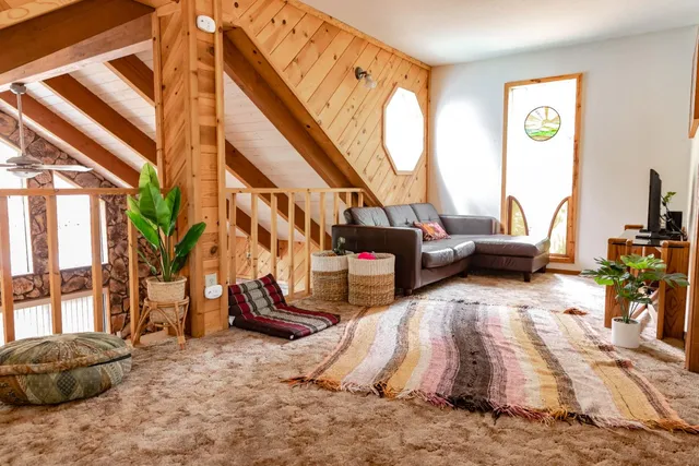 a view of living room with furniture and floor to ceiling windows