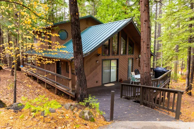 a view of house with outdoor space and sitting area