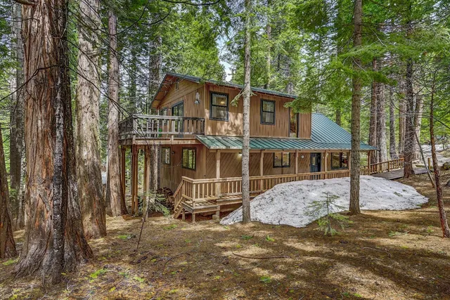 a view of a porch with wooden floor and stairs