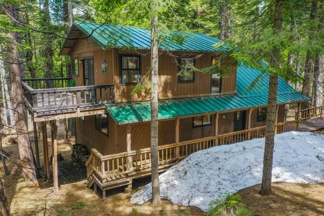 a view of a balcony with wooden floor
