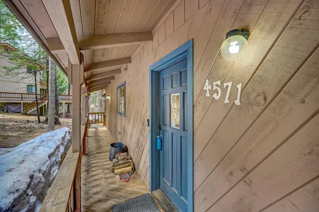 a view of a house with wooden stairs