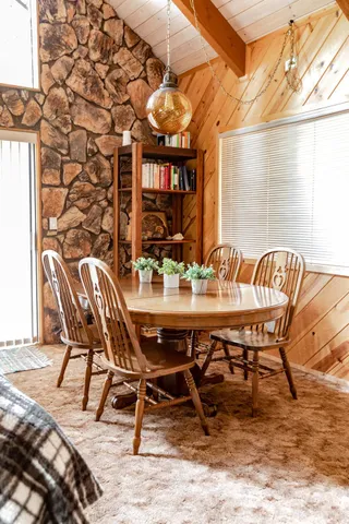 a view of a patio with a table and chairs
