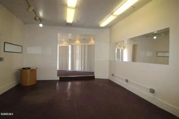 a view of a hallway with windows