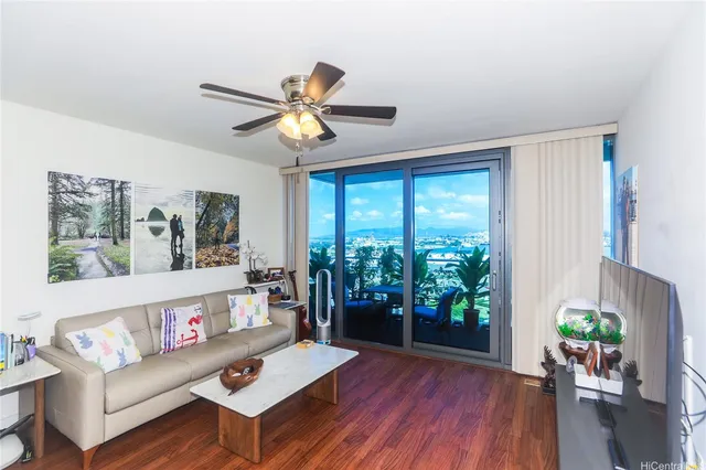 a living room with furniture and a large window
