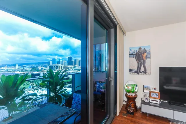 a view of a porch with furniture and a potted plant