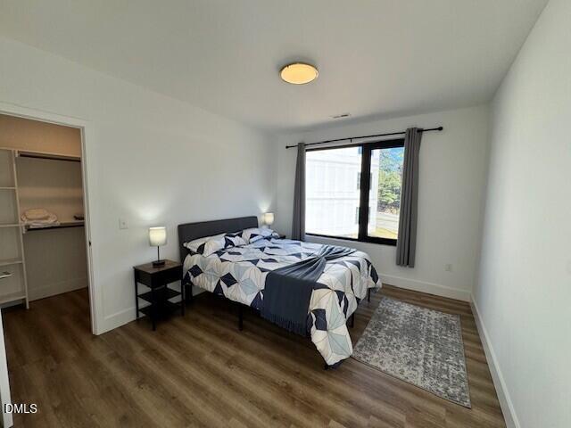 1115 Nova Street Durham, NC 27713 - Photo 12 of 24 a bedroom with a bed and a window