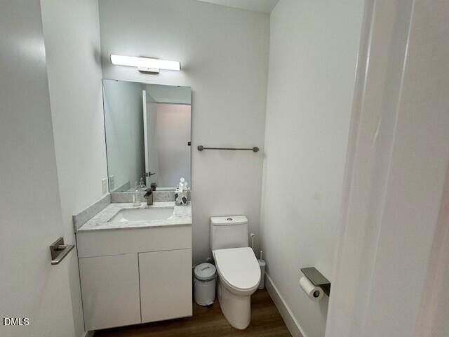 1115 Nova Street Durham, NC 27713 - Photo 17 of 24 a bathroom with a toilet sink and mirror