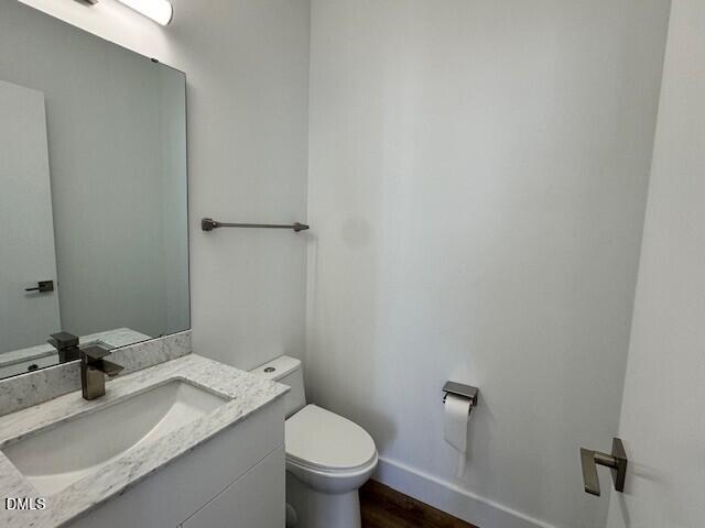1115 Nova Street Durham, NC 27713 - Photo 24 of 24 a bathroom with a granite countertop sink vanity mirror and toilet
