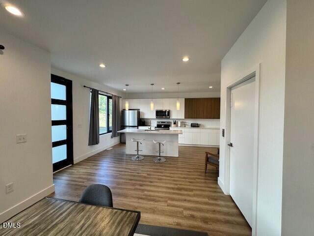 1115 Nova Street Durham, NC 27713 - Photo 3 of 24 a living room with furniture and a kitchen view