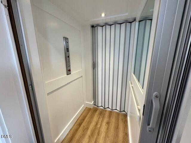 1115 Nova Street Durham, NC 27713 - Photo 6 of 24 a view of a closet with wooden floor