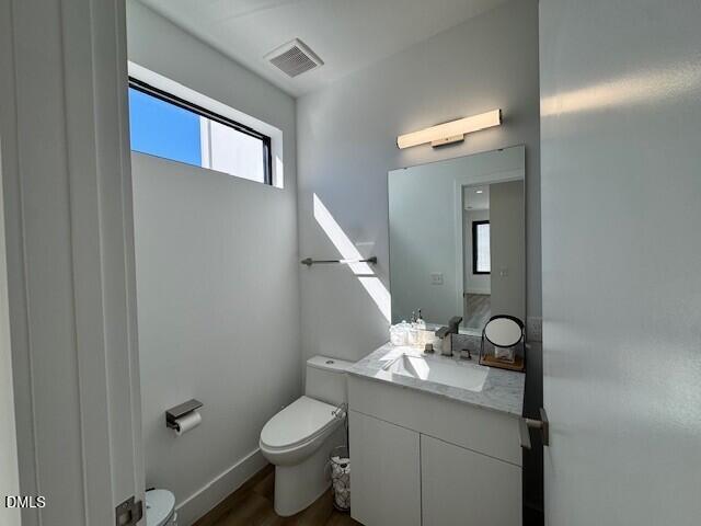 1115 Nova Street Durham, NC 27713 - Photo 9 of 24 a bathroom with a granite countertop toilet and a sink