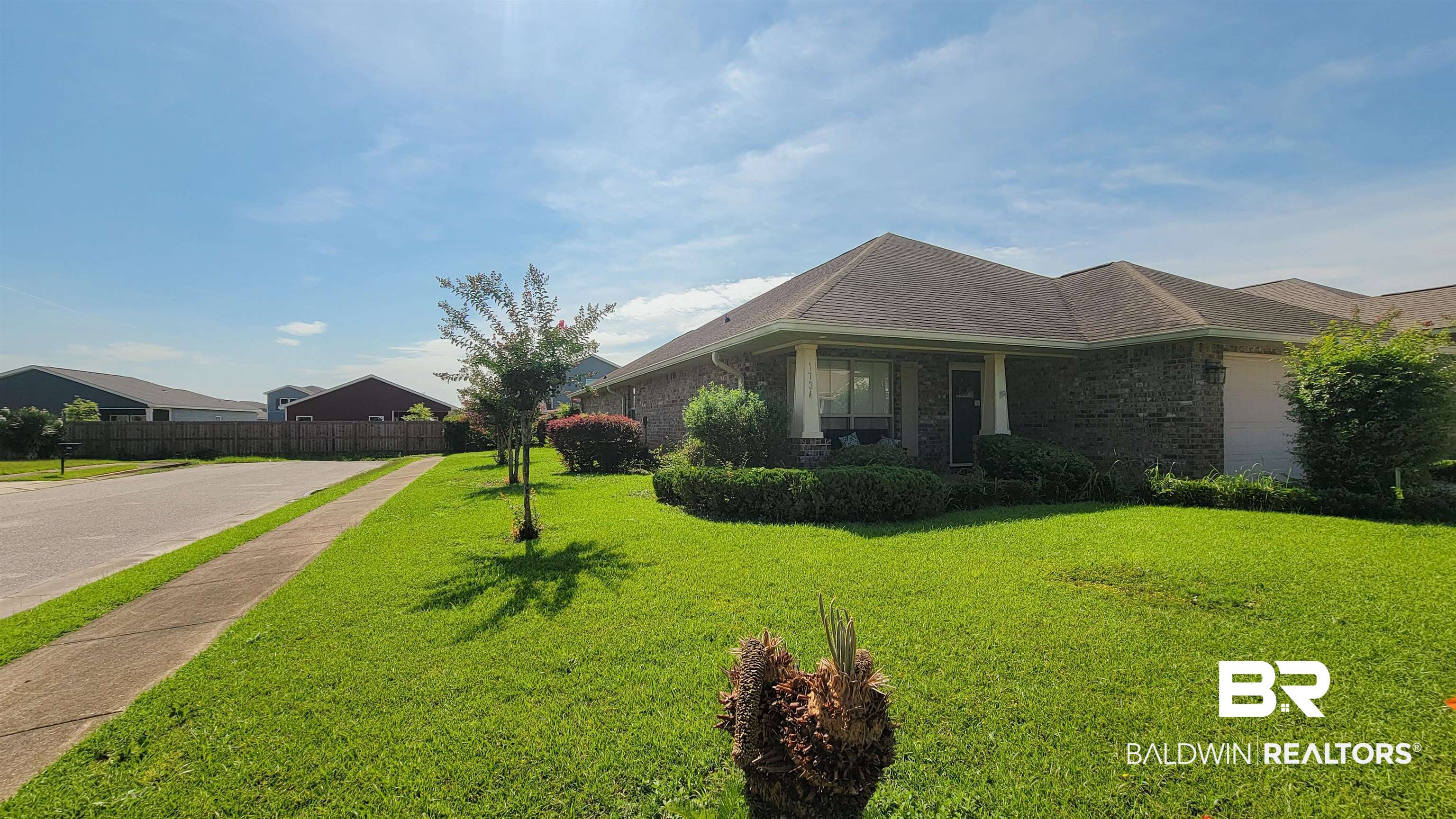 1704 Arcadia Drive Foley, AL 36535 - Photo 6 of 52 View of home's exterior featuring brick siding and roof with shingles