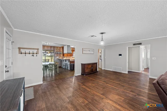 a view of a livingroom with furniture and wooden floor