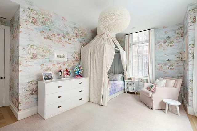 a bed room with a bed and a window