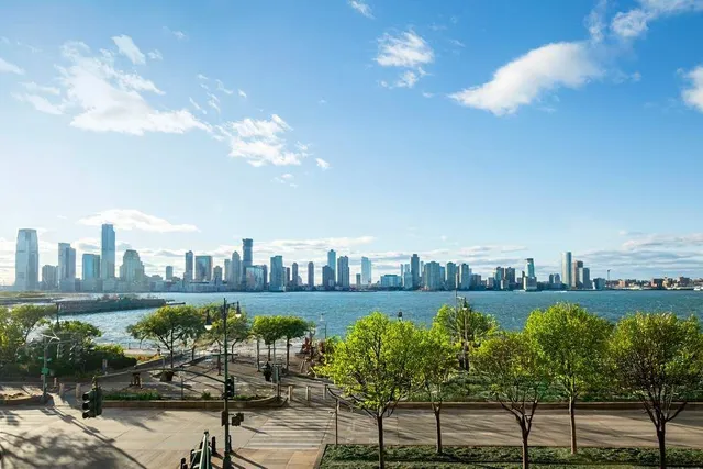 a view of a swimming pool and lounge chairs
