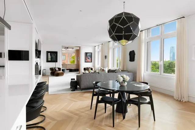 a dining room with furniture and window