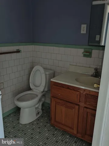 a bathroom with a toilet and a sink