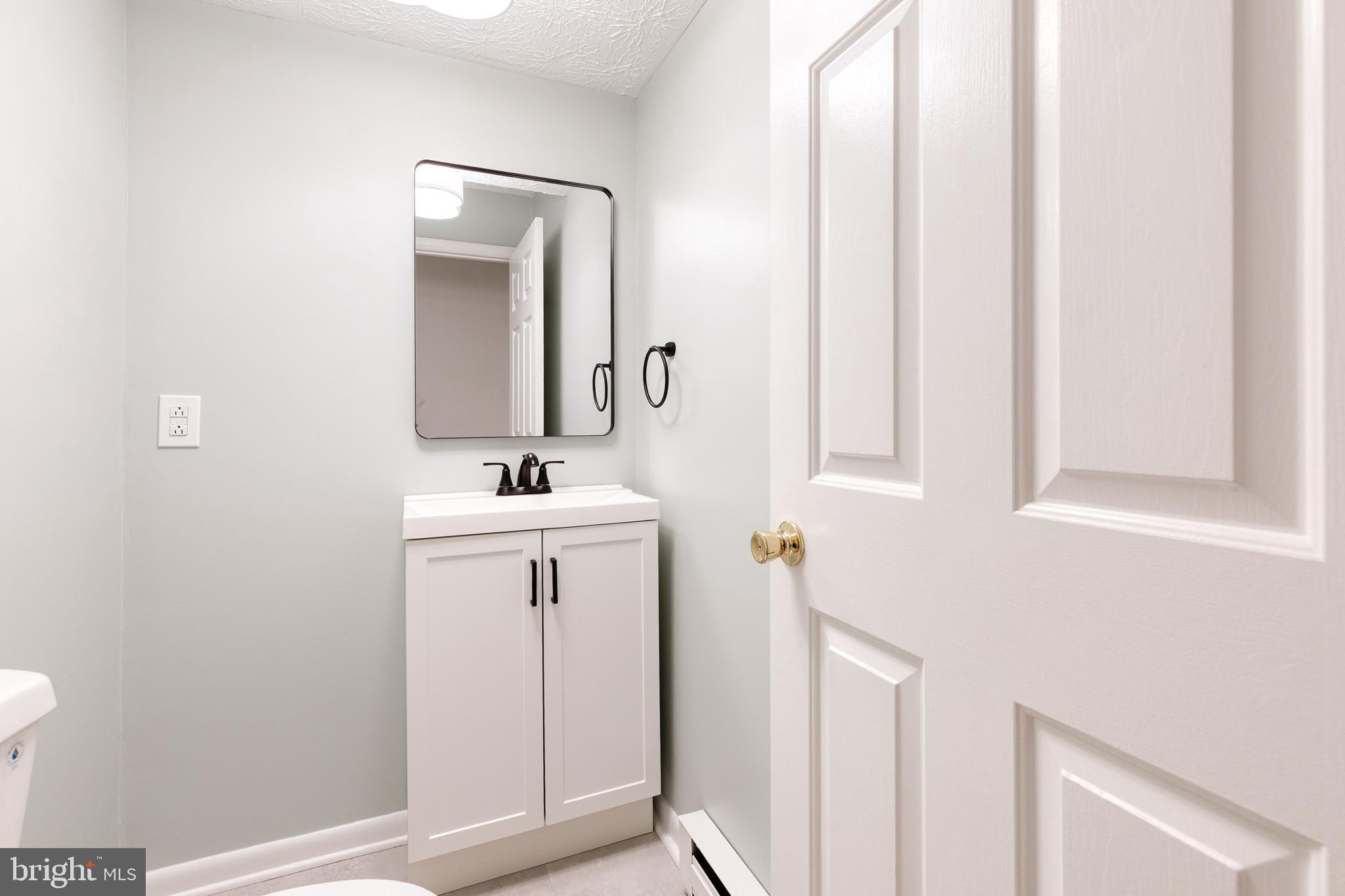 1216 Bonaire Road Forest Hill, MD 21050 - Photo 50 of 71 a bathroom with a sink and a mirror
