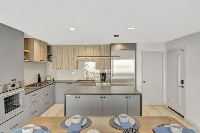 a living room with furniture a flat screen tv and a large window