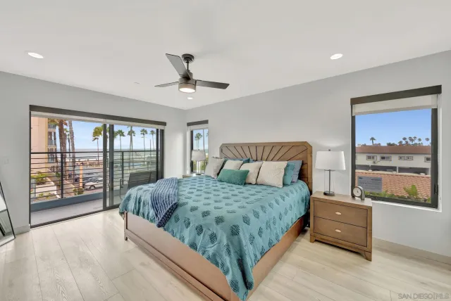 a bathroom with double vanity and a mirror