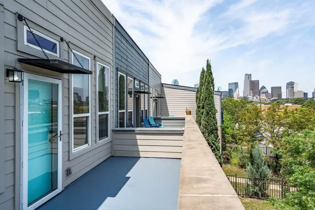 a view of a brick house with many windows