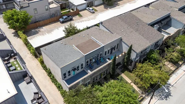 an aerial view of a house with wooden stairs