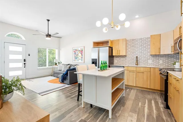 a kitchen with a sink stove and cabinets