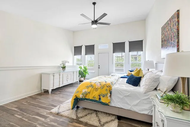 a bedroom with a bed window and couch