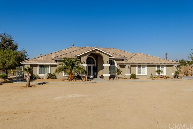 a view of a house with outdoor space and sitting area