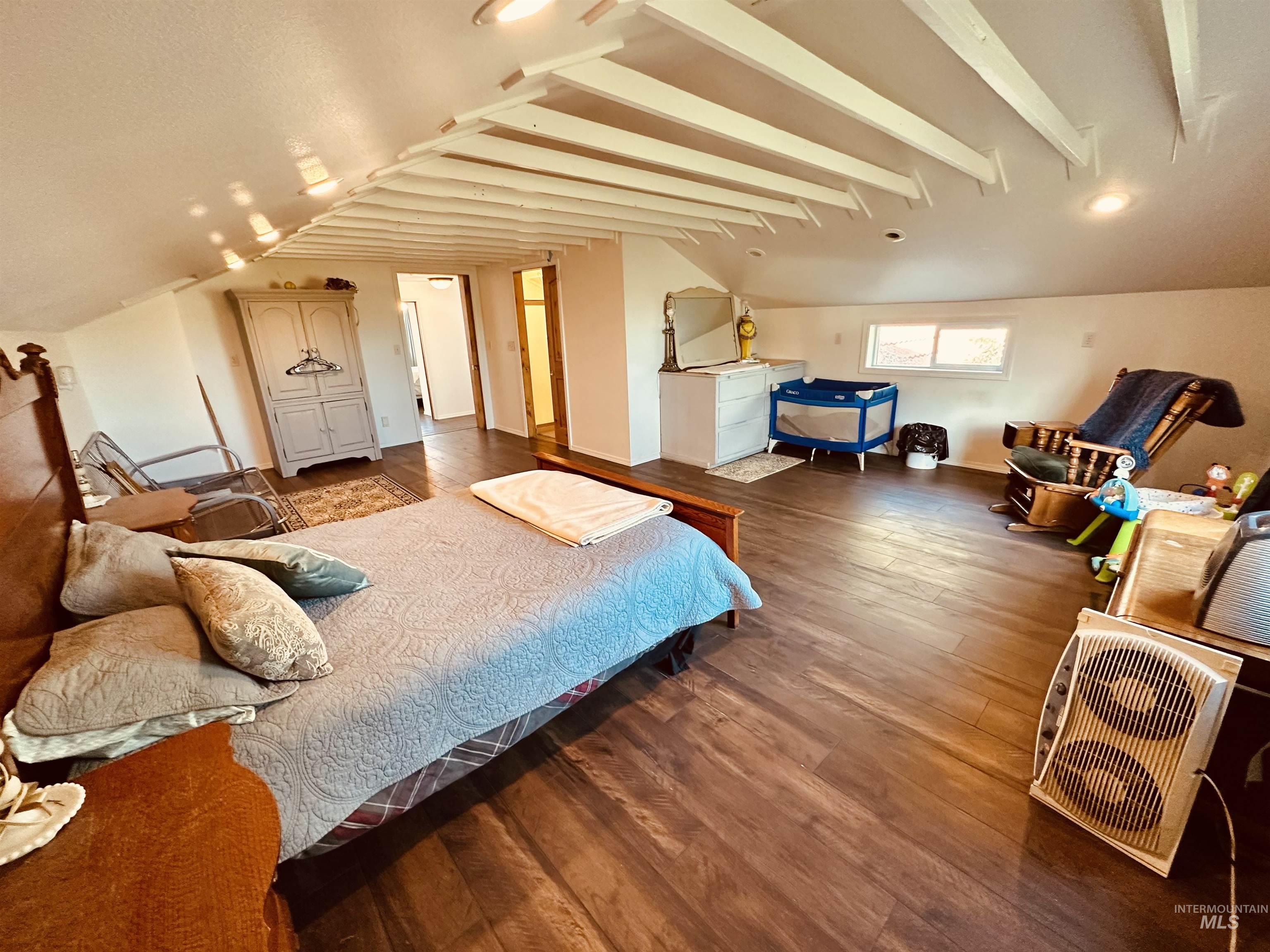 1049 Grand Avenue Nyssa, OR 97913 - Photo 21 of 50 Spacious room featuring wood-finish flooring, an exposed beam ceiling, and recessed lighting