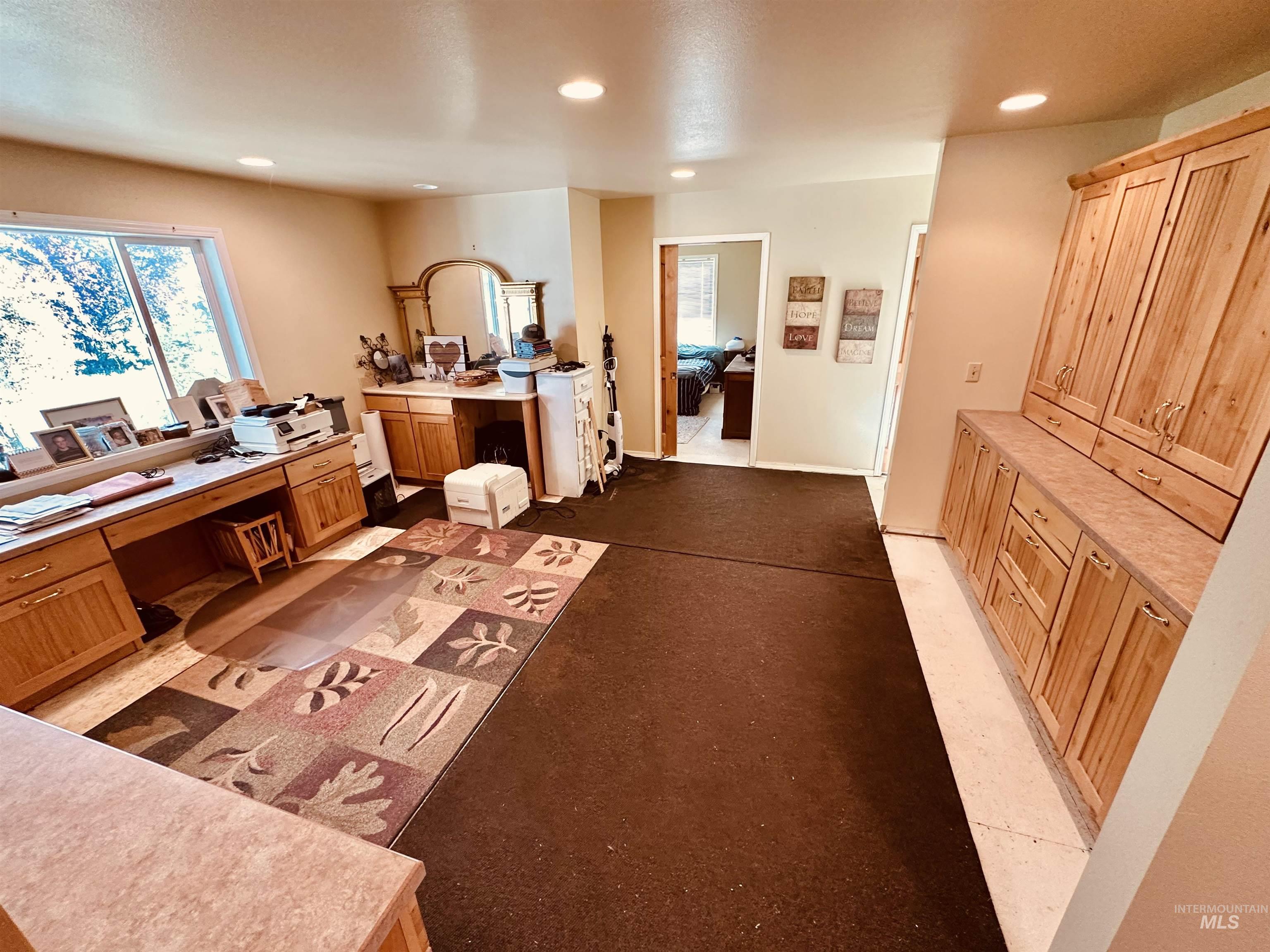 1049 Grand Avenue Nyssa, OR 97913 - Photo 28 of 50 Spacious room featuring multiple built-in wood cabinets and extensive countertop space