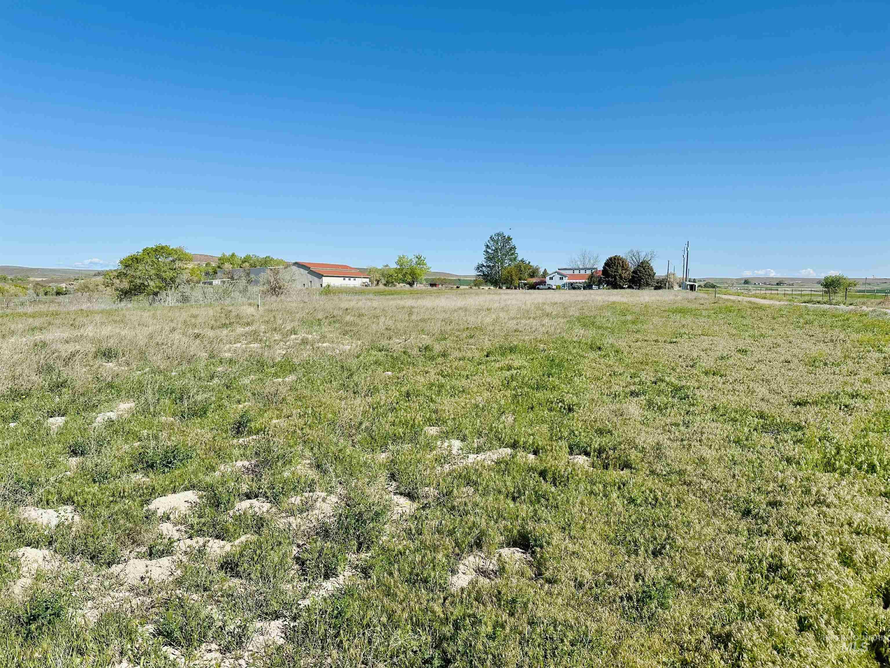1049 Grand Avenue Nyssa, OR 97913 - Photo 49 of 50 Expansive open acreage with a distant residential structure