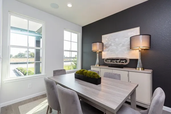 a kitchen with a table and chairs