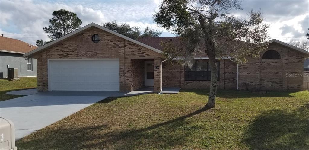 839 Tulip Street Deltona, FL 32725 - Photo 1 of 1 a view of a house with a yard