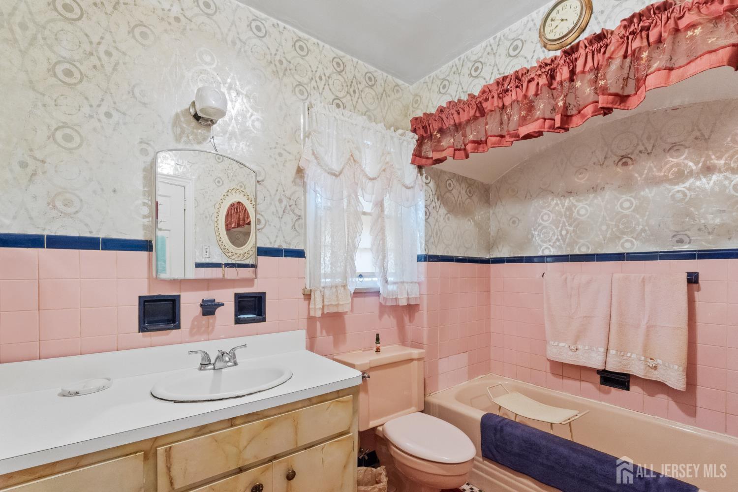 72 Bailey Avenue Hillside, NJ 07205 - Photo 11 of 20 a bathroom with a sink toilet and shower