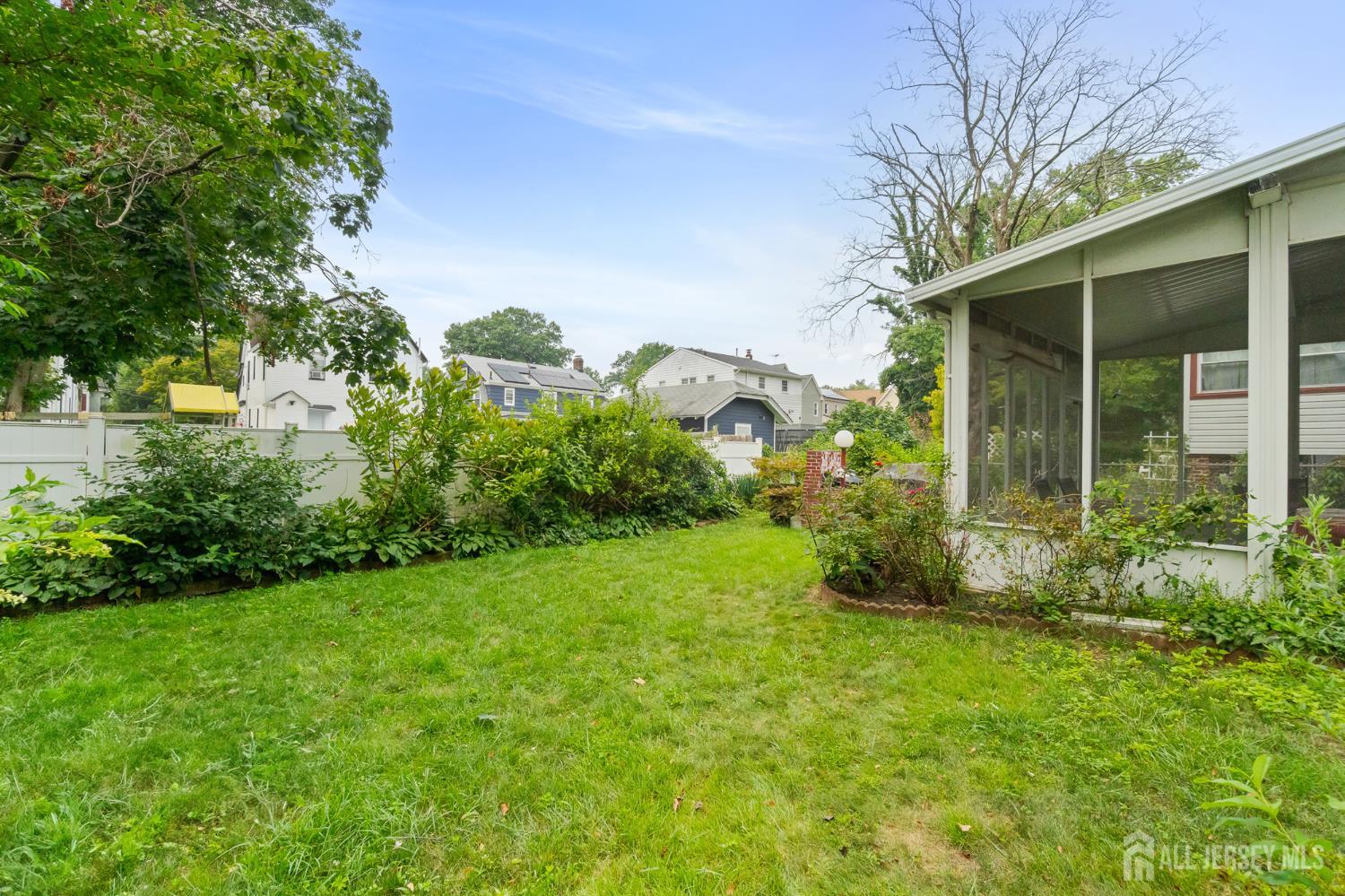 72 Bailey Avenue Hillside, NJ 07205 - Photo 16 of 20 a view of a garden in front of a house