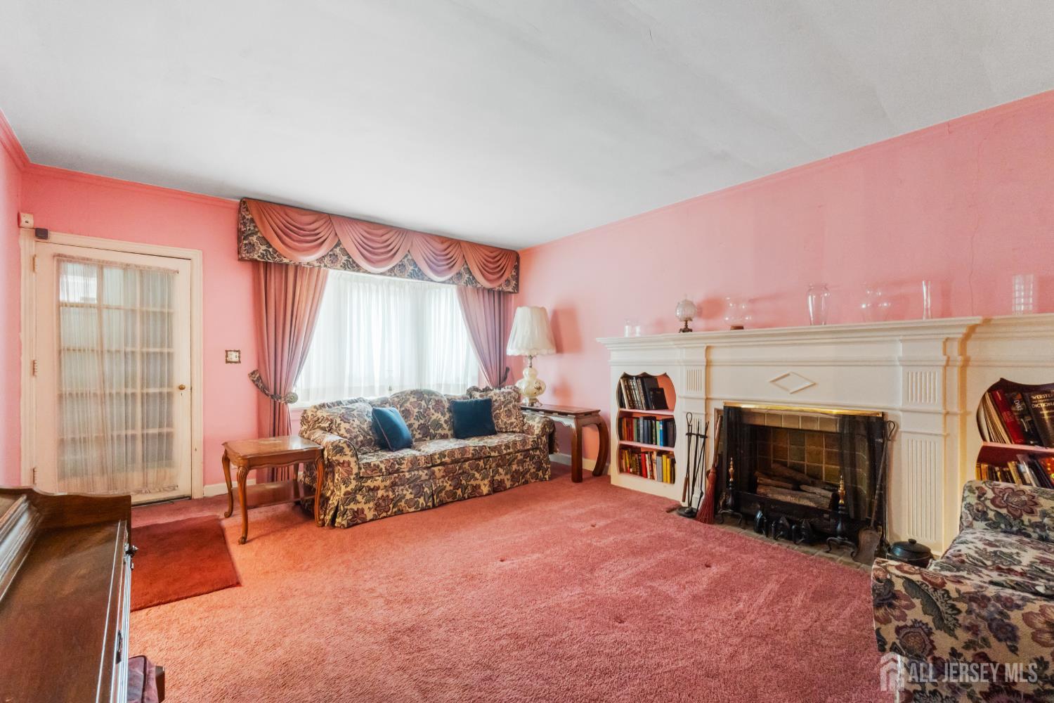 72 Bailey Avenue Hillside, NJ 07205 - Photo 2 of 20 a living room with furniture and a fireplace