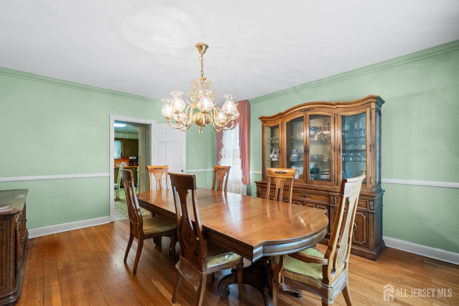 72 Bailey Avenue Hillside, NJ 07205 - Photo 3 of 20 a view of a dining room with furniture and chandelier