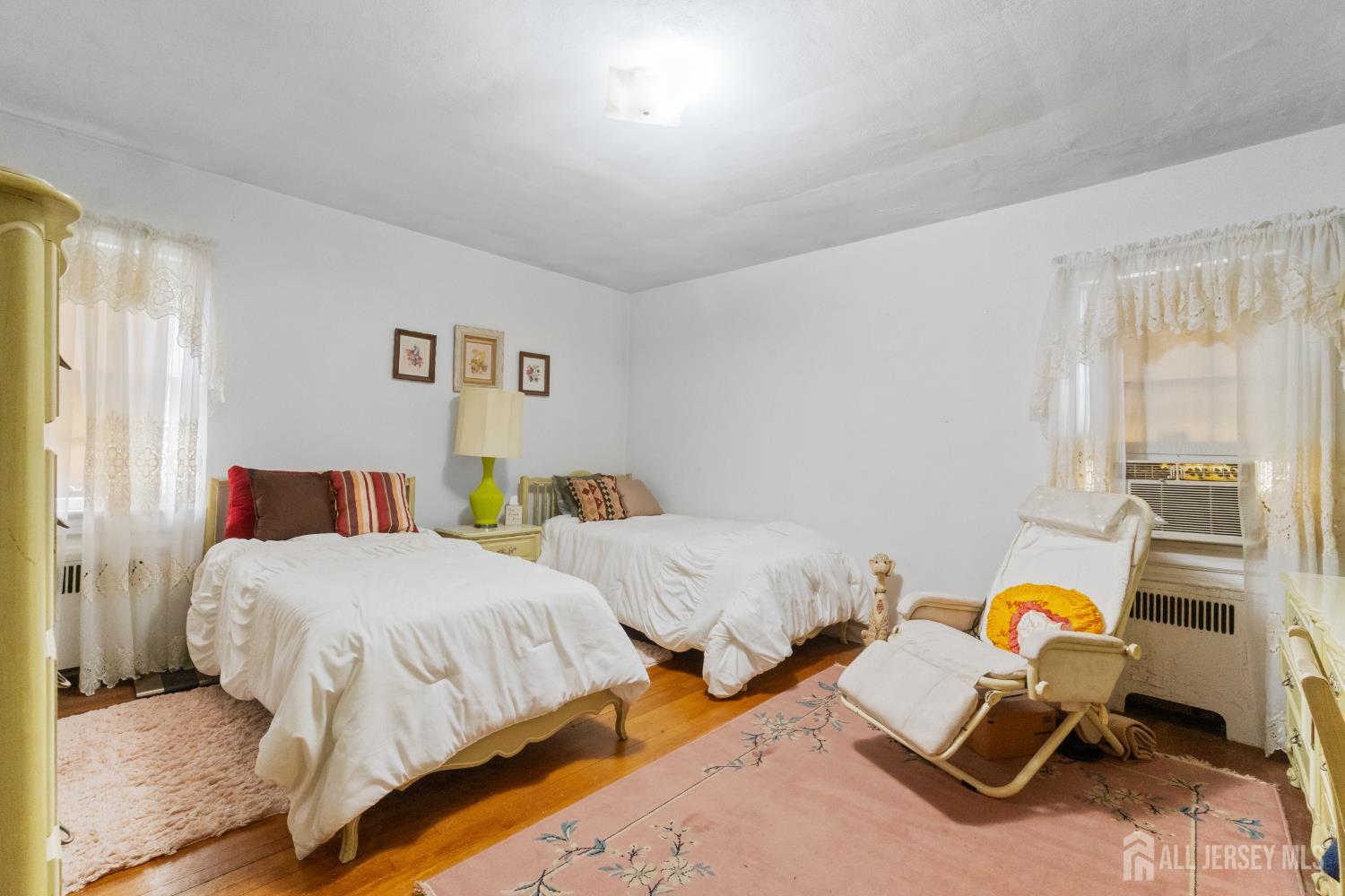 72 Bailey Avenue Hillside, NJ 07205 - Photo 8 of 20 a bedroom with two beds and painted walls