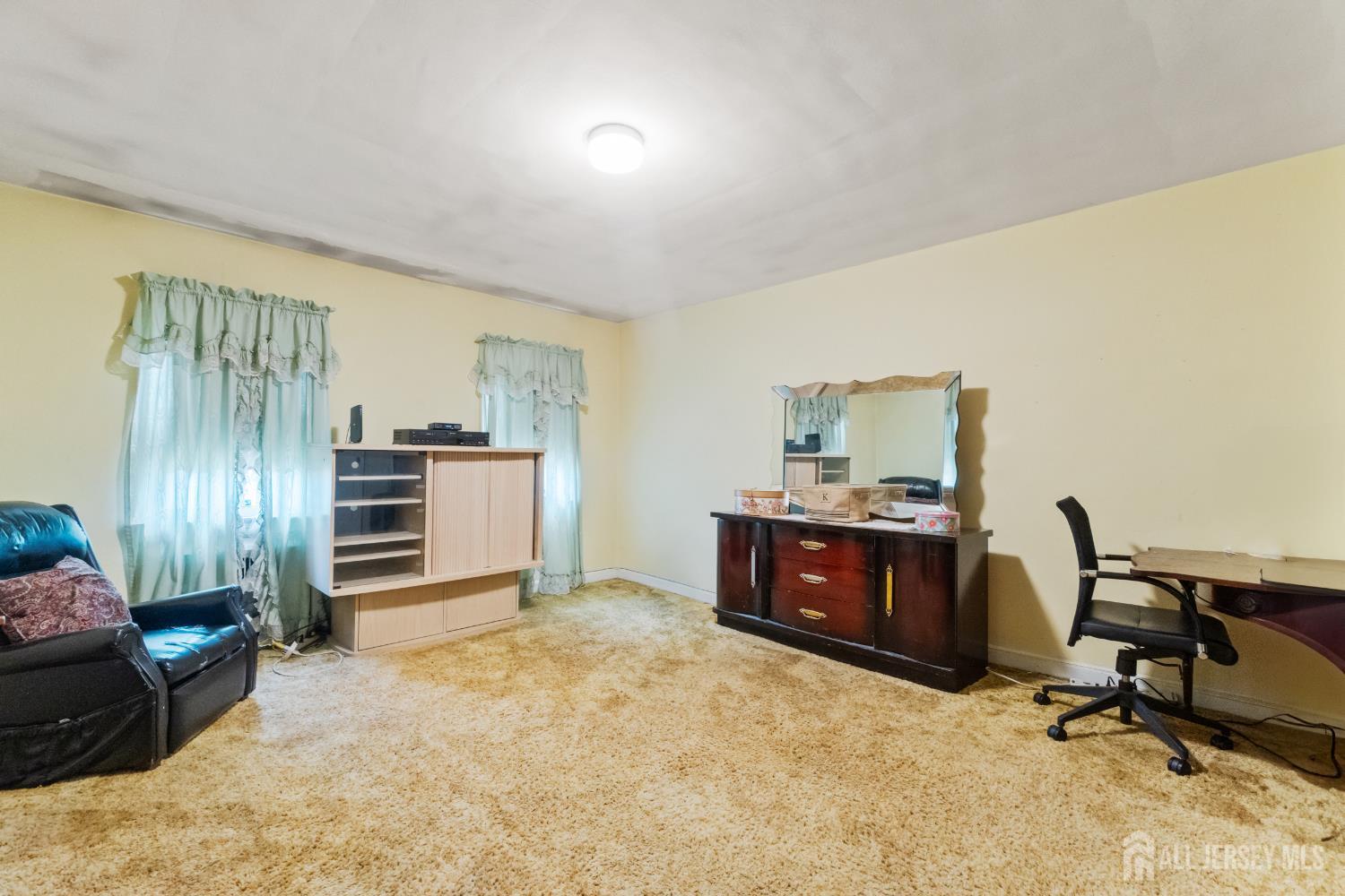 72 Bailey Avenue Hillside, NJ 07205 - Photo 9 of 20 a room with furniture and windows