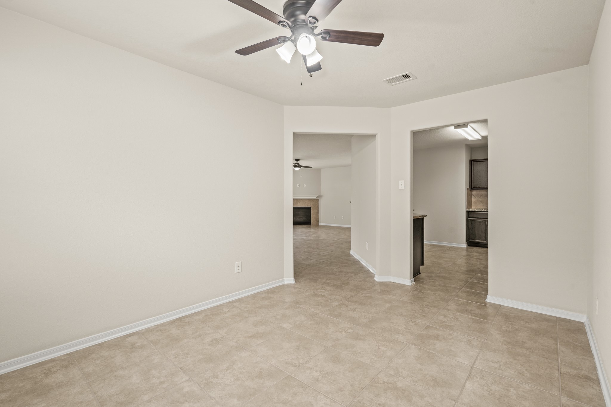 3118 Winchester Rnch Trail Katy, TX 77493 - Photo 22 of 36 an empty room with chandelier fan and closet area