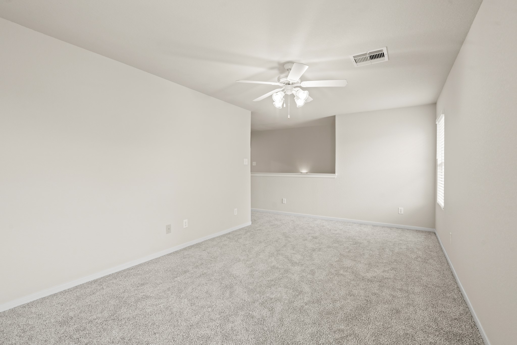 3118 Winchester Rnch Trail Katy, TX 77493 - Photo 24 of 36 an empty room with a bathroom and a ceiling fan