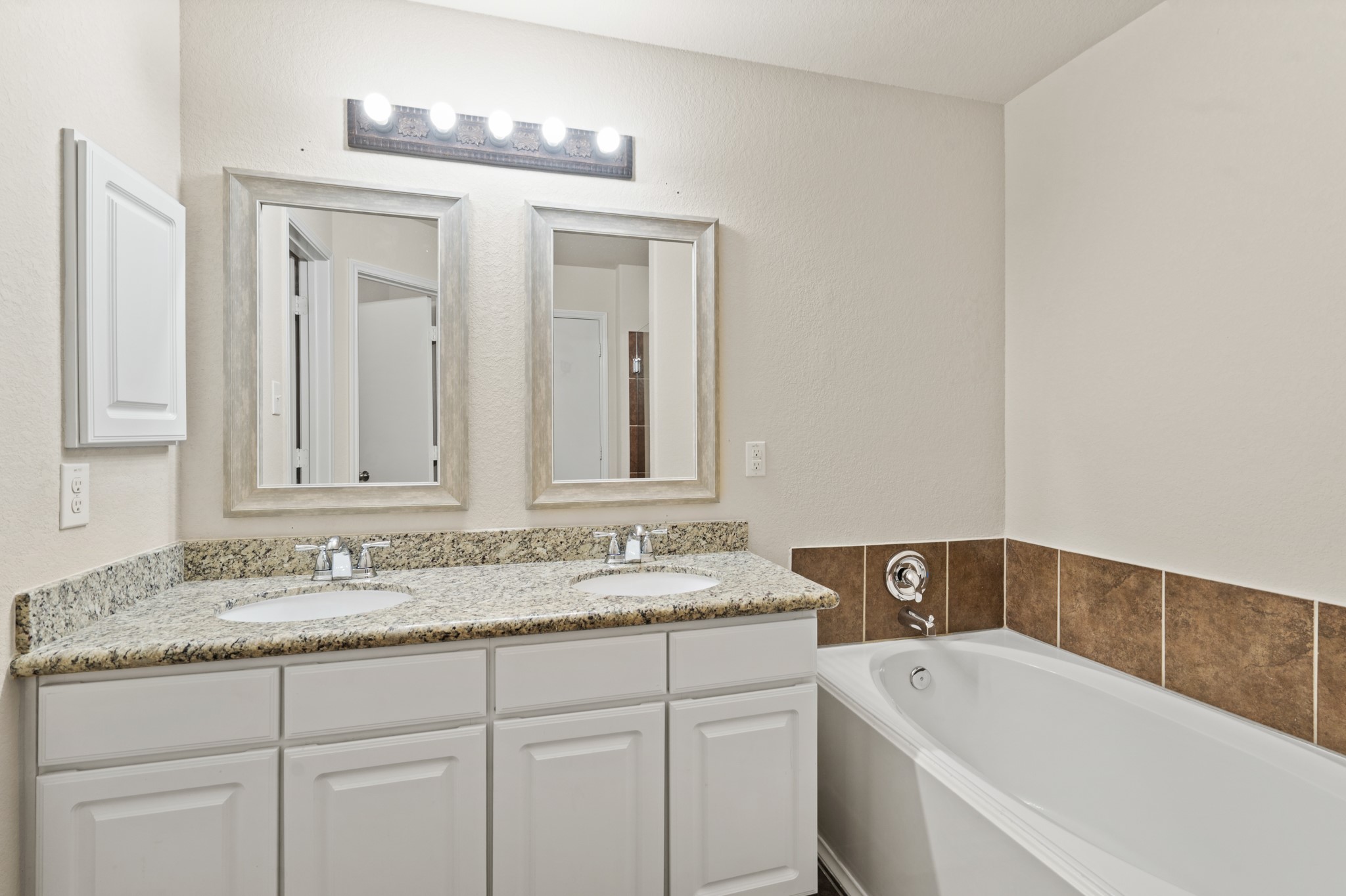 3118 Winchester Rnch Trail Katy, TX 77493 - Photo 30 of 36 a bathroom with a tub sink and mirror