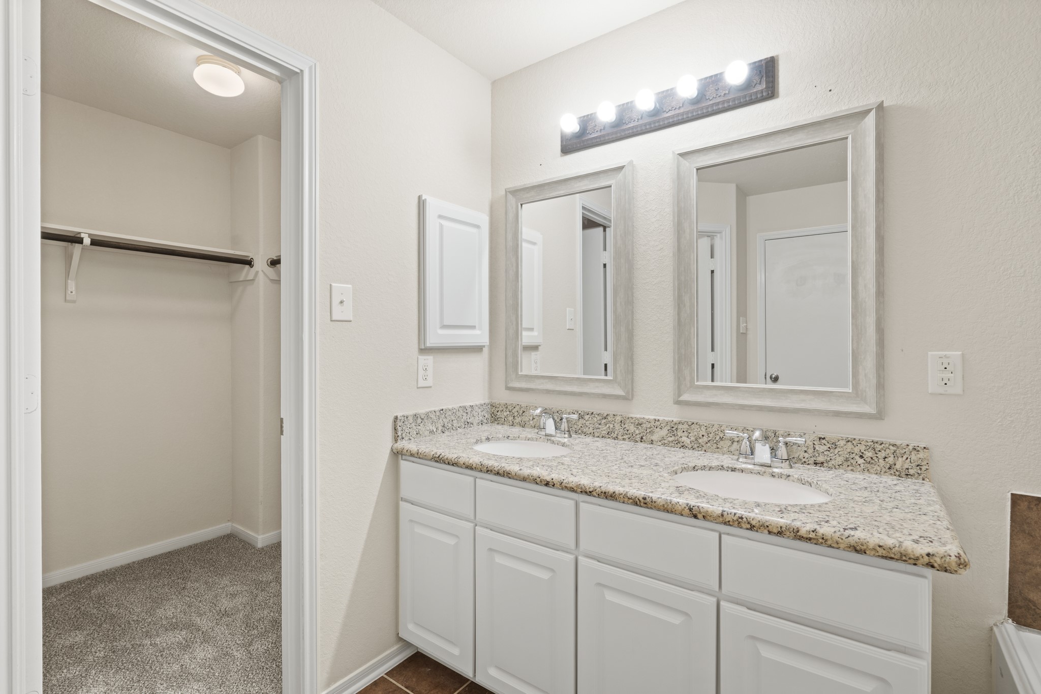 3118 Winchester Rnch Trail Katy, TX 77493 - Photo 31 of 36 a bathroom with a granite countertop sink and a mirror