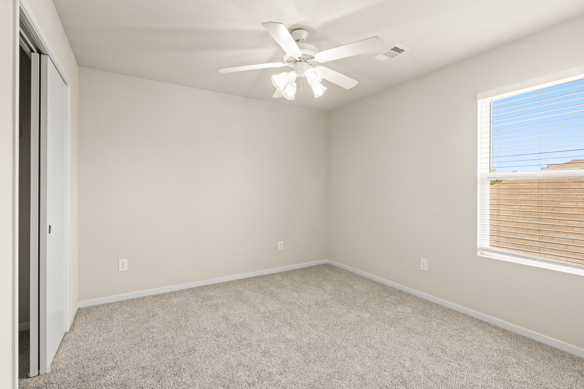3118 Winchester Rnch Trail Katy, TX 77493 - Photo 33 of 36 an empty room with a window and a fan