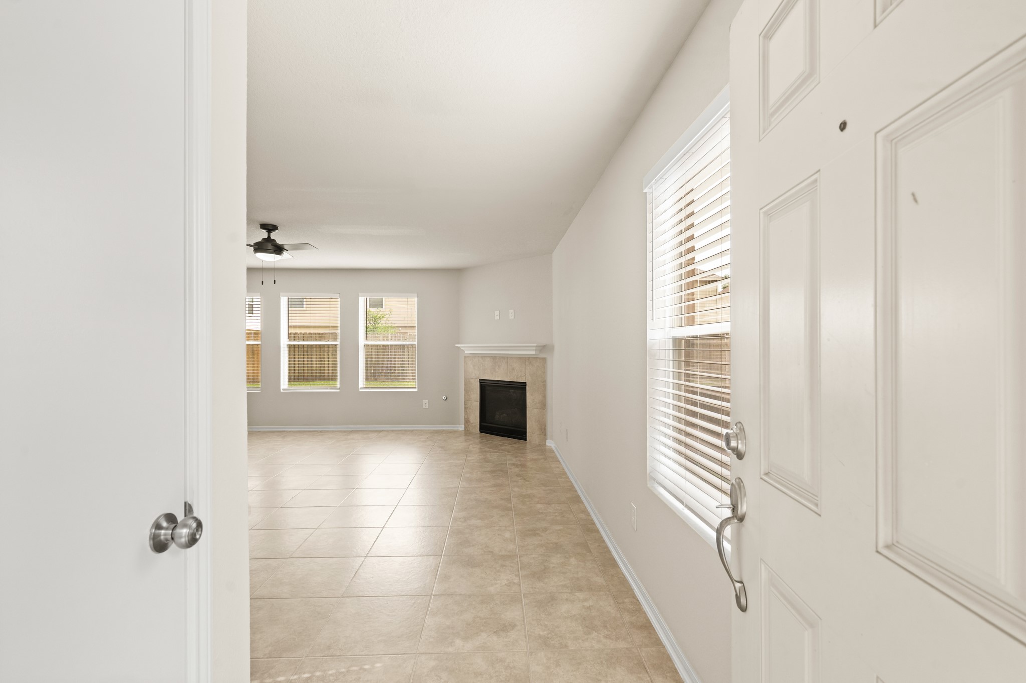 3118 Winchester Rnch Trail Katy, TX 77493 - Photo 7 of 36 a view of a hallway with wooden shelves and windows
