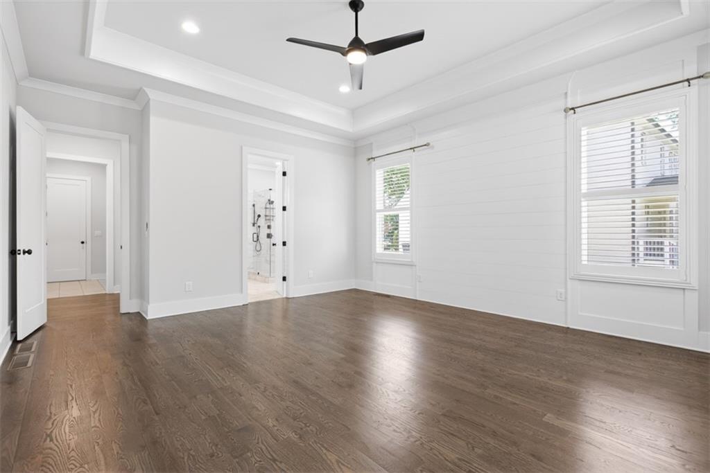 3528 North Bogan Road Buford, GA 30519 - Photo 23 of 79 a view of an empty room with wooden floor and a window